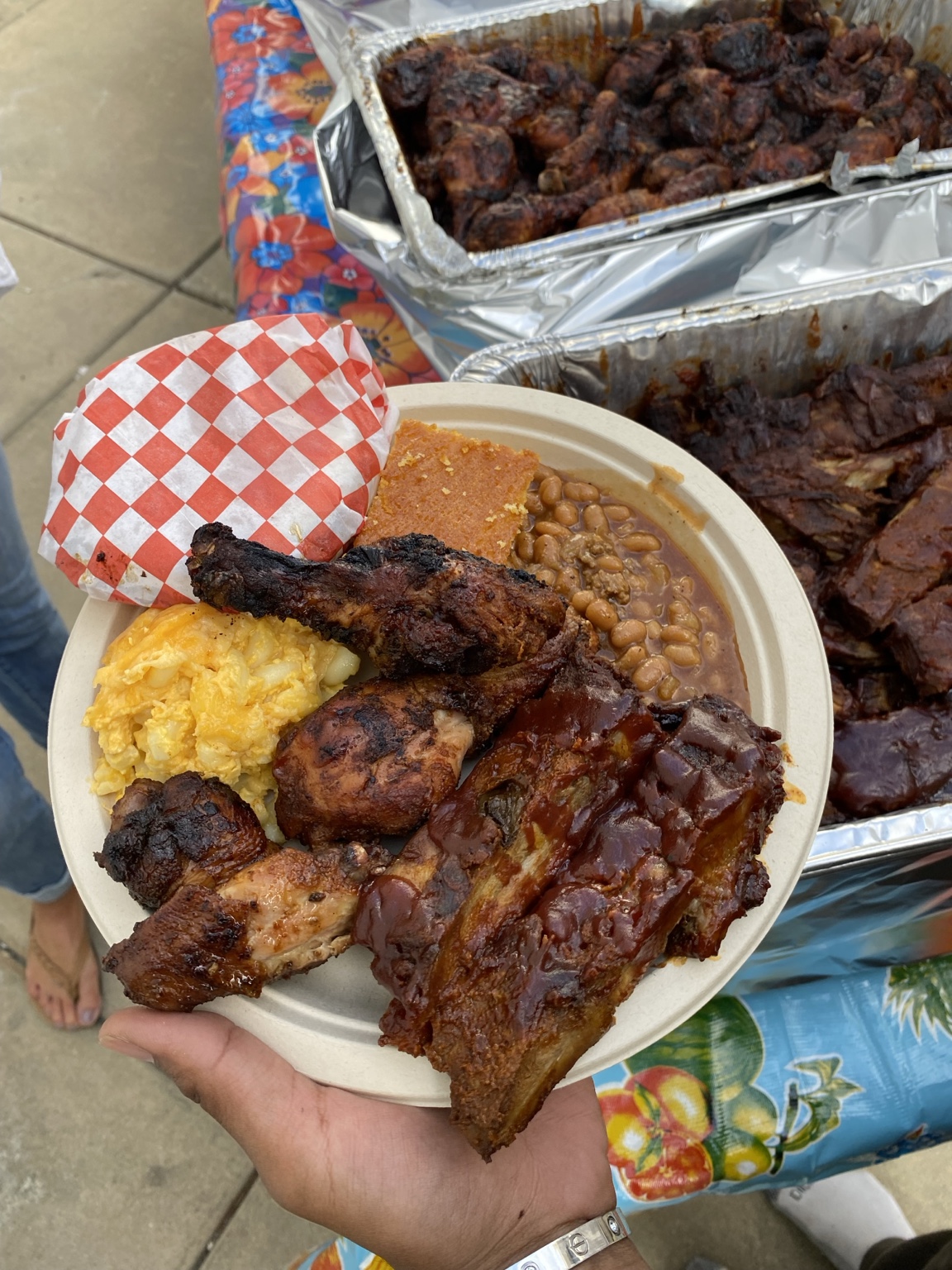 O'Side BBQ Man ribs and chicken plate with baked beans, macaroni and cheese, and cornbread