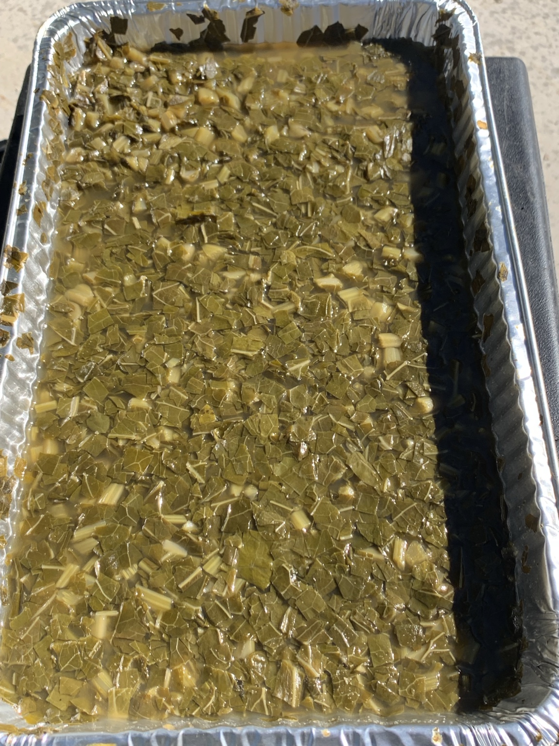 O’SIDE BBQ MAN freshly cooked collard greens in a catering tray